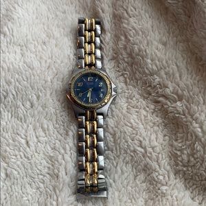 Guess men’s water resistant silver/gold tone watch